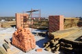 Getting ready to build an attic or a loft and a roof by preparing construction materials such as bricks, braces, roof beams, Royalty Free Stock Photo