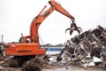 Getting rid of unwanted rubbish. a crane at work in a dumpsite. Royalty Free Stock Photo
