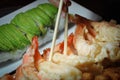 Getting shrimp tempura using chopstick Royalty Free Stock Photo