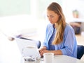 Getting some emails out of the way. a young woman using her laptop at home. Royalty Free Stock Photo