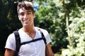 Getting some exercise in the most beautiful surroundings. a handsome young man hiking in the forest. Royalty Free Stock Photo