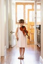 Getting in some violin practive. a young girl playing violin.