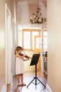 Getting in some violin practive. a young girl playing violin. Royalty Free Stock Photo