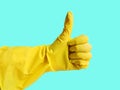 Getting started cleaning. Yellow rubber gloves for cleaning on white background .General or regular cleanup. Royalty Free Stock Photo