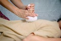 Getting Thai herbal compress massage in spa Royalty Free Stock Photo