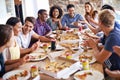 Getting together for pizza. a group of friends enjoying pizza together.