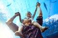 Getting up close and personal with the sea. a father and his little daughter looking at an exhibit in an aquarium. Royalty Free Stock Photo