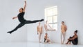 Getting used to being in front of the crowd. Full length shot of a diverse group of ballet students rehearsing in their Royalty Free Stock Photo