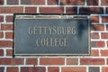 The Gettysburg College sign imbedded in a brick wall on campus Royalty Free Stock Photo