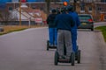 GETTYSBURG, USA - APRIL, 18, 2018: Back view line of tourists on Segways Seg Tours in Gettysburg National Military Park