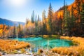 Geyser lake with turquoise water in autumn Altai mountains, Siberia, Russia Royalty Free Stock Photo