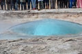 Strokkur geyser just before erupting and many tourists waiting