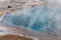 Geysir Golden Circle in Iceland deep blue water in geothermal pool steaming hot Royalty Free Stock Photo
