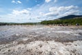 People wait for Strokkur Geyser to erupt in front of a crowd Royalty Free Stock Photo