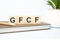 gfcf word written on wooden cubes with copy space