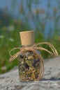 Gglass bottle with dried herbs