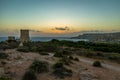 Ghajn Tuffieha Tower in Golden Bay at sunset - Malta Royalty Free Stock Photo