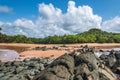 Ghana beach with rocks and sea meet from two sides Royalty Free Stock Photo