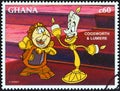 GHANA - CIRCA 1996: A stamp printed in Ghana shows Cogsworth and Lumiere, circa 1996.