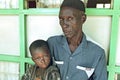 Group portrait of Ghanaian grandpa and grandson