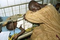 Ghanaian father is guarding his sick child in hospital