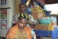 Ghanaian woman at barber shop and grocery store Royalty Free Stock Photo