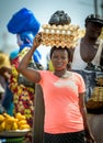 ACCRA,REPUBLIC OF GHANA - APRIL 30,2018:Ghanaian woman carries a box of eggs on her head