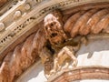 Gargoyle and lion on facade of Siena Cathedral Royalty Free Stock Photo