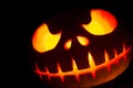 Ghastly Halloween pumpkin head jack lantern on black background Royalty Free Stock Photo