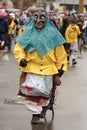 Ghastly witch with pitchfork at Carnival parade, Stuttgart