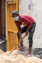 Indian migrant worker With Medical Mask At Construction Site During Unlockdown India