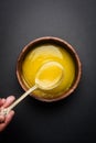 Indian or desi ghee or pure ghee served in a wooden bowl Royalty Free Stock Photo