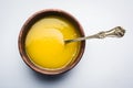 Indian or desi ghee or pure ghee served in a wooden bowl