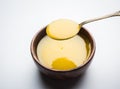 Indian or desi ghee or pure ghee served in a wooden bowl Royalty Free Stock Photo