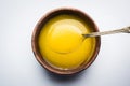 Indian or desi ghee or pure ghee served in a wooden bowl Royalty Free Stock Photo