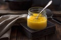 Ghee or clarified butter in a jar. Royalty Free Stock Photo