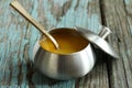 Ghee / Clarified butter on rustic blue background, selective focus Royalty Free Stock Photo