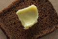 Ghee on a piece of coarse rye bread. Royalty Free Stock Photo