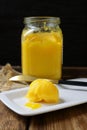 Ghee on a white plate, close-up. A healthy high fat dairy product.