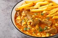 Gheimeh or Qeimeh is an Iranian stew consisting of diced mutton or beef, tomatoes, split peas, onion and dried lime, garnished