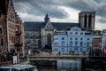 Ghent Belgium - April 15 : Toursists walk across the bridge near the Saint Michael\'s Church in Ghent, Belgium