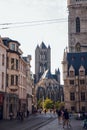 GHENT, BELGIUM - August, 2019: Facade of Saint Nicholas` Church Sint-Niklaaskerk with the clock tower of Belfry of Ghent Het Royalty Free Stock Photo