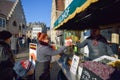 GHENT, BELGIUM - DECEMBER 05 2016 - Woman buying belgian waffle on the streets of Ghent, Belgium