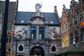 Ghent, Belgium; 10/29/2018: Facade of the Fish Market with the statue of Neptune in Sint-Veerleplein square