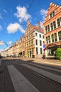 Historical street with buildings in typical Flemish architecture, painted with vivid colors. Royalty Free Stock Photo