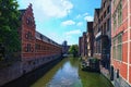 Houses and cafes sit on the water. Urban landscape photo. Royalty Free Stock Photo