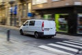 Ghent, Belgium; 10/31/2018: Panning effect photography of a white furgo through a street in the city