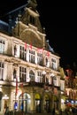 Ghent, Belgium; 10/27/2019: Vertical picture of the illuminated facade of Nederlands Toneel Gent NTGent or NTG, a famous theatre