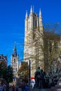 Ghent, Belgium; 10/26/2019: Vertical picture of Saint Bavo Cathedral Sint-Baafskathedraal with Belfry of Ghent Het Belfort at