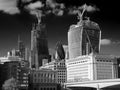 The `Gherkin` between two skyscrapers under construction in the City of London